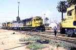 Santa Fe San Berdoo bound freight (ATSF 8775 west) w #5591, ex Amtrak #632, #5302, & 8775 cut power off train to make a pickup in yard.